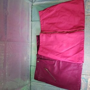 TWO for one price faux leather miniskirts.
